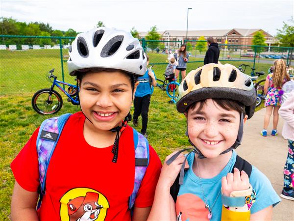 Students bike to school in the morning.